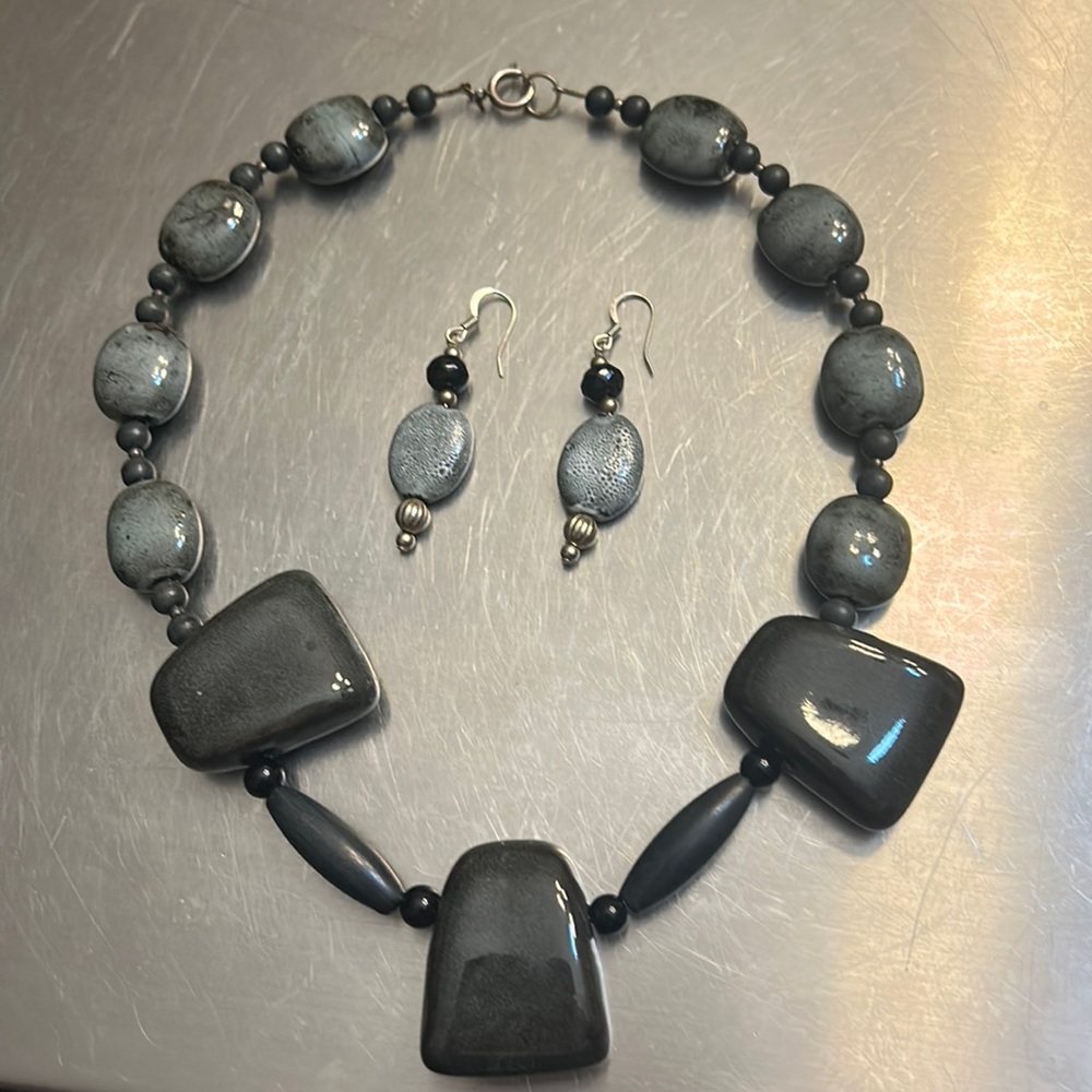 Set necklace and earrings with black and gray stones set in silver tone